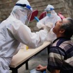 Covid-19 outbreak in Xinjiang prompts fears of spread inside China’s camps