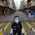 Thousands of Hong Kongers locked down to contain coronavirus